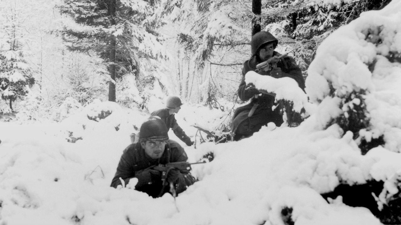 American infantrymen of the 290th Regiment of the US Army fight in fresh snowfall near Amonines, Belgium. The fighting and German counter-offensive on the Belgian-German border later became famous as the Battle of the Bulge